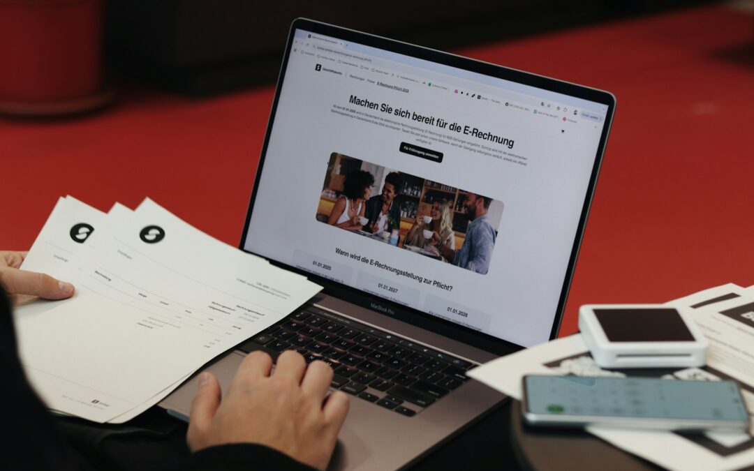 A person sitting in front of a laptop computer
